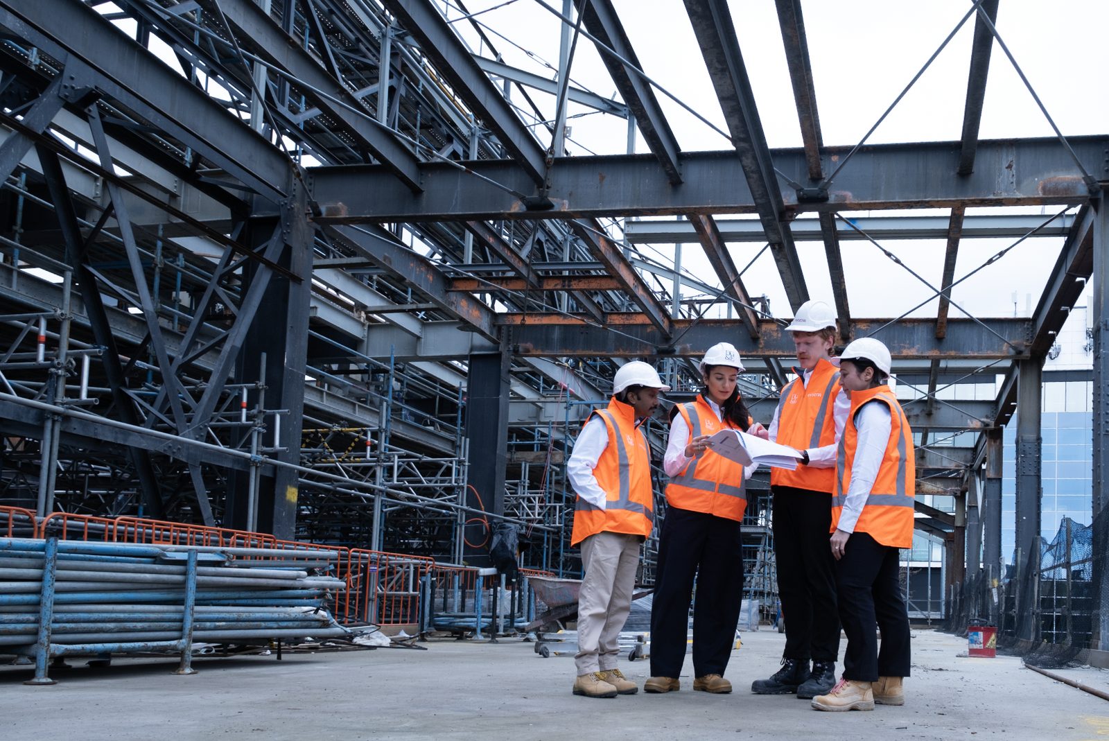 BG&E engineers reviewing drawings on a structural steel site